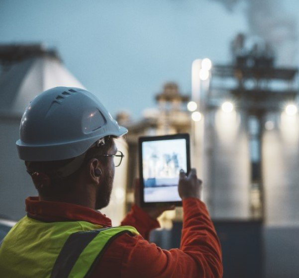 Engineer inspecting industrial energy infrastructure